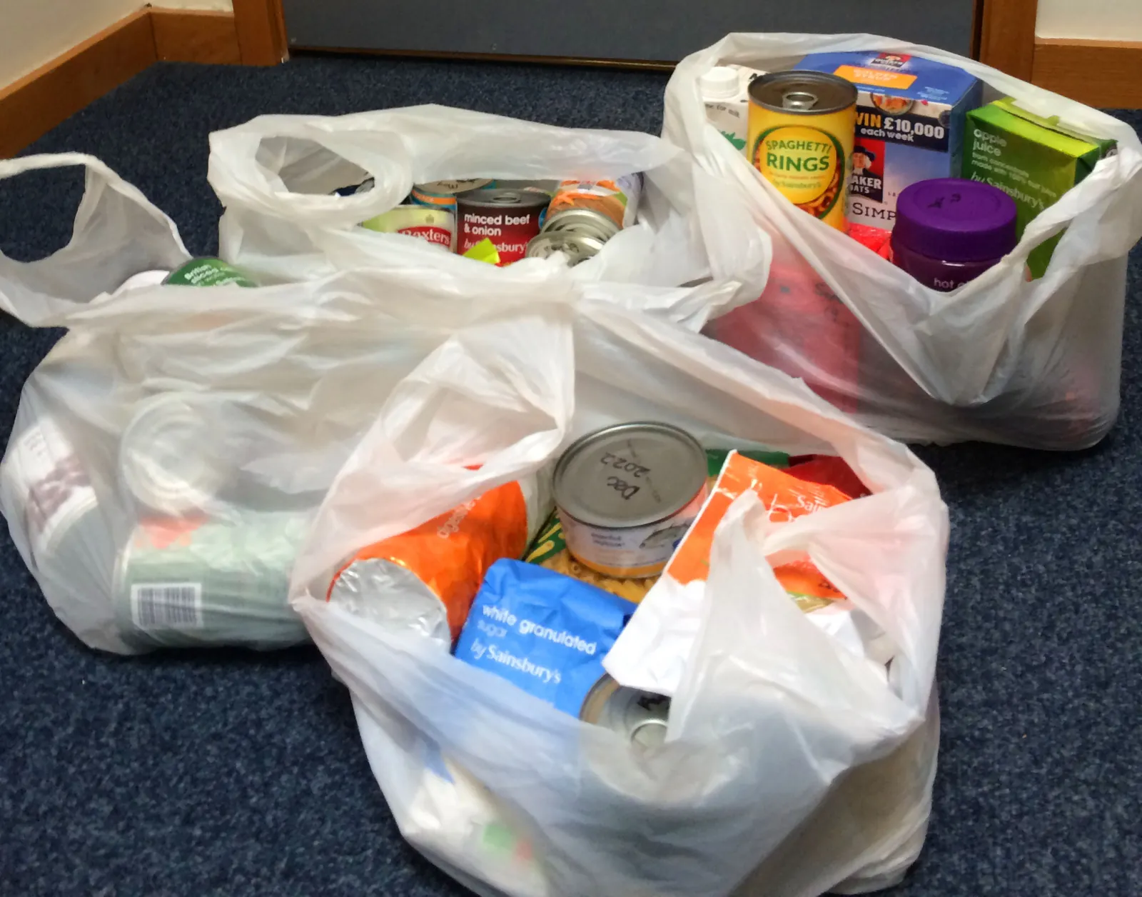 Carrier bags packed with food parcels, ready to be delivered